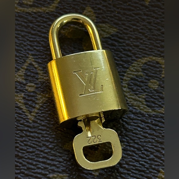 Louis Vuitton Handbags - Authentic Louis Vuitton Lock & Key Set #322. Good condition.
